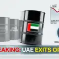 The flags of the UAE and OPEC separated by a symbolic crack, representing the historic exit. Representative Image