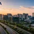 Modern skyline of Noida featuring the Noida Expressway, corporate office towers, residential high-rises, and green urban infrastructure during sunset, symbolizing the city’s rapid smart city transformation representative image.