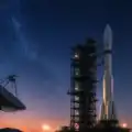 Futuristic space-tech launch facility with a rocket standing on a launch pad under a star-filled night sky, representing India’s growing private space technology ecosystem representative image.