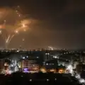 Night skyline showing defensive missile interceptions during a period of heightened regional tensions. Representative image used for illustrative purposes.