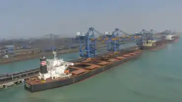 A massive cargo ship at Adani Port Mundra, representing the milestone of 500 million tonnes handled by Adani Ports as of April 1, 2026.