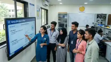 A realistic scene of young Maharashtrian students in a modern, well-lit tech lab at a state college, learning Artificial Intelligence modules on a large screen as part of the Maharashtra AI Policy 2026 – Akhand News.