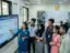A realistic scene of young Maharashtrian students in a modern, well-lit tech lab at a state college, learning Artificial Intelligence modules on a large screen as part of the Maharashtra AI Policy 2026 – Akhand News.
