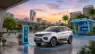 A modern electric car charging at a high-speed charging station with a solar panel roof in an Indian city. Representive Image