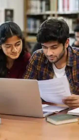 Indian university students researching scholarship opportunities in a modern academic library.
