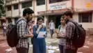 Indian students outside exam center holding admit cards, concerned after NEET UG 2026 cancellation news