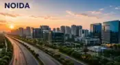Modern skyline of Noida featuring the Noida Expressway, corporate office towers, residential high-rises, and green urban infrastructure during sunset, symbolizing the city’s rapid smart city transformation representative image.