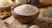 Natural psyllium husk (Isabgol) displayed in a wooden bowl representing dietary fiber and digestive wellness.