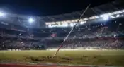 Javelin resting on the athletics field after a record-breaking throw at an international stadium.
