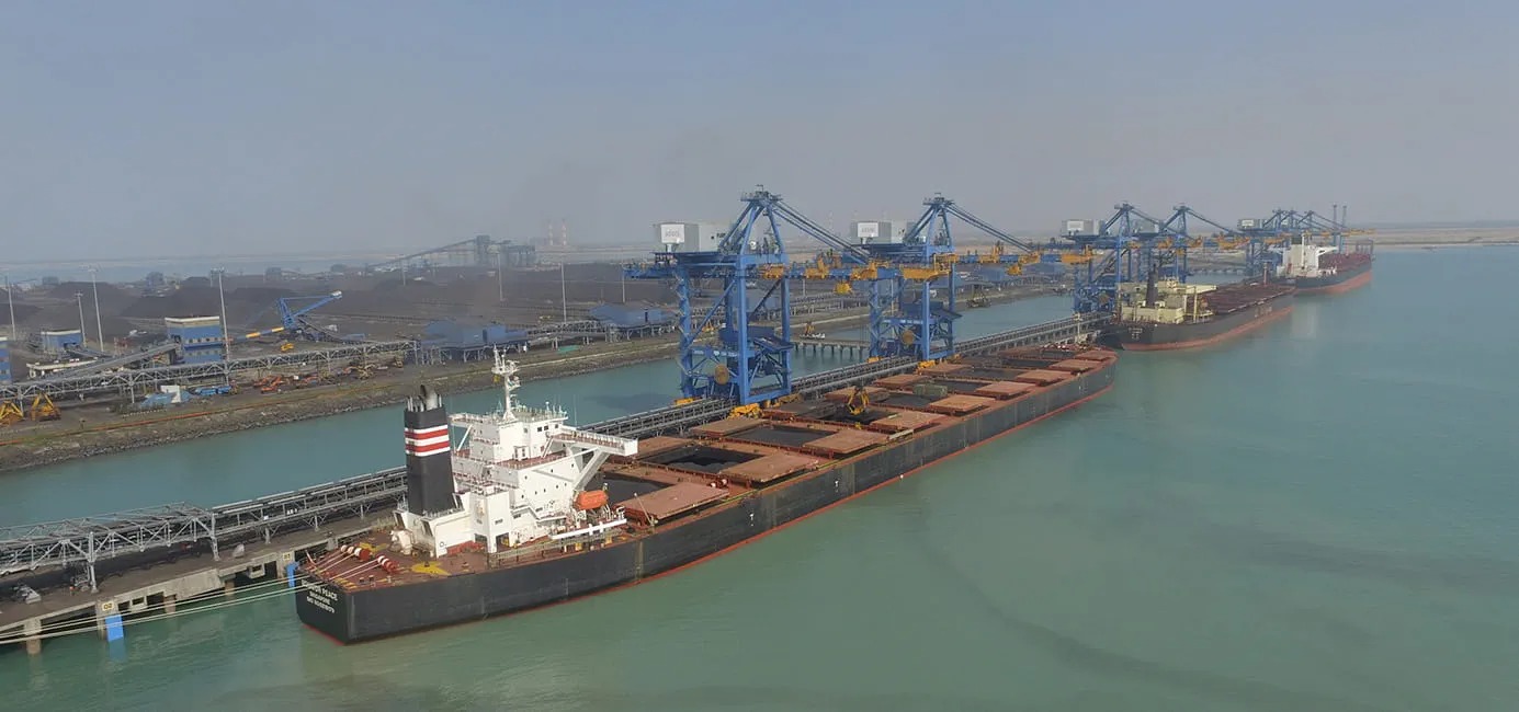 A massive cargo ship at Adani Port Mundra, representing the milestone of 500 million tonnes handled by Adani Ports as of April 1, 2026.
