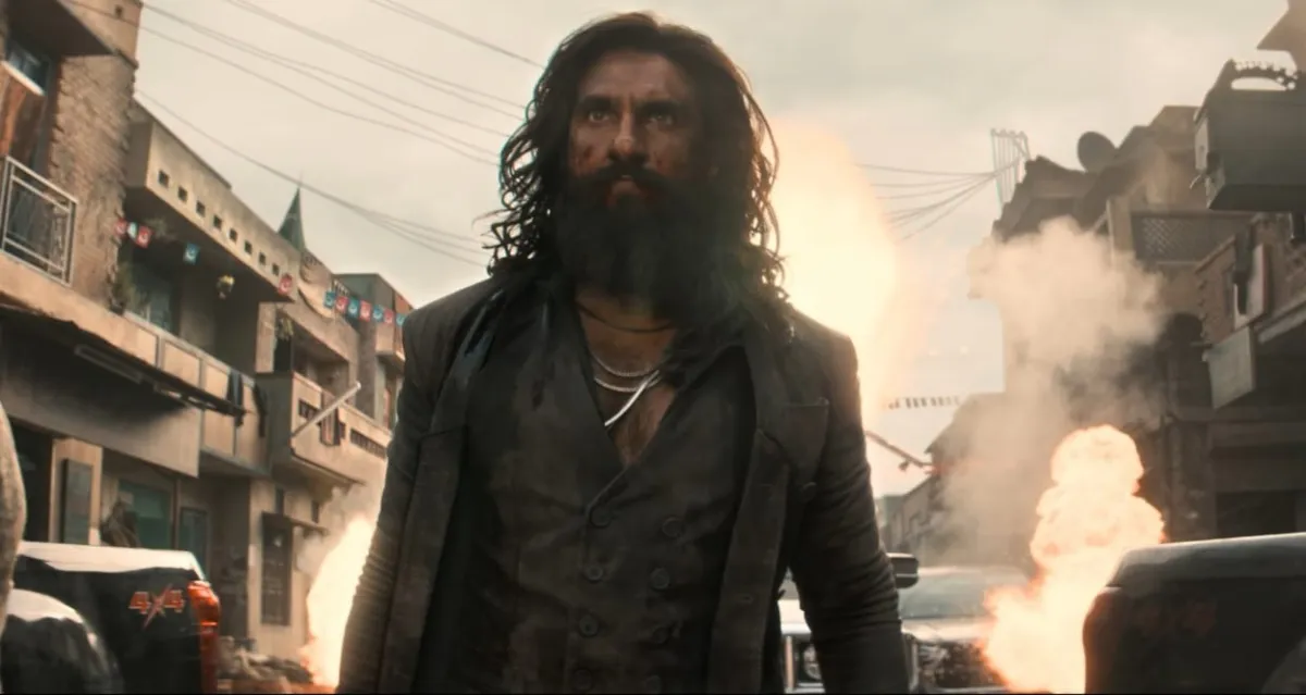 Dhurandhar 2 movie poster featuring Ranveer Singh, celebrating the ₹1450 crore worldwide box office milestone on April 1, 2026.