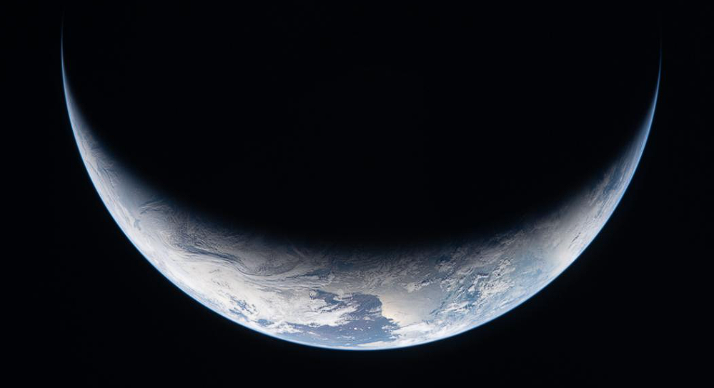 The Orion spacecraft with parachutes deployed during its descent into the ocean. Image Credit: NASA / Artemis II Mission