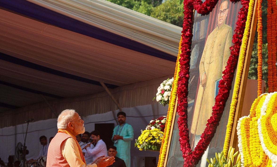 PM Narendra Modi paying floral tribute to a statue of Dr. B.R. Ambedkar. Image Credit: @narendramodi/X Handle