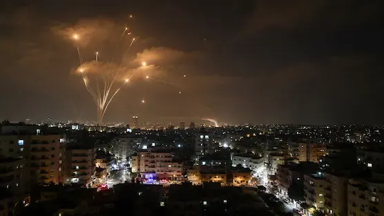 Night skyline showing defensive missile interceptions during a period of heightened regional tensions. Representative image used for illustrative purposes.